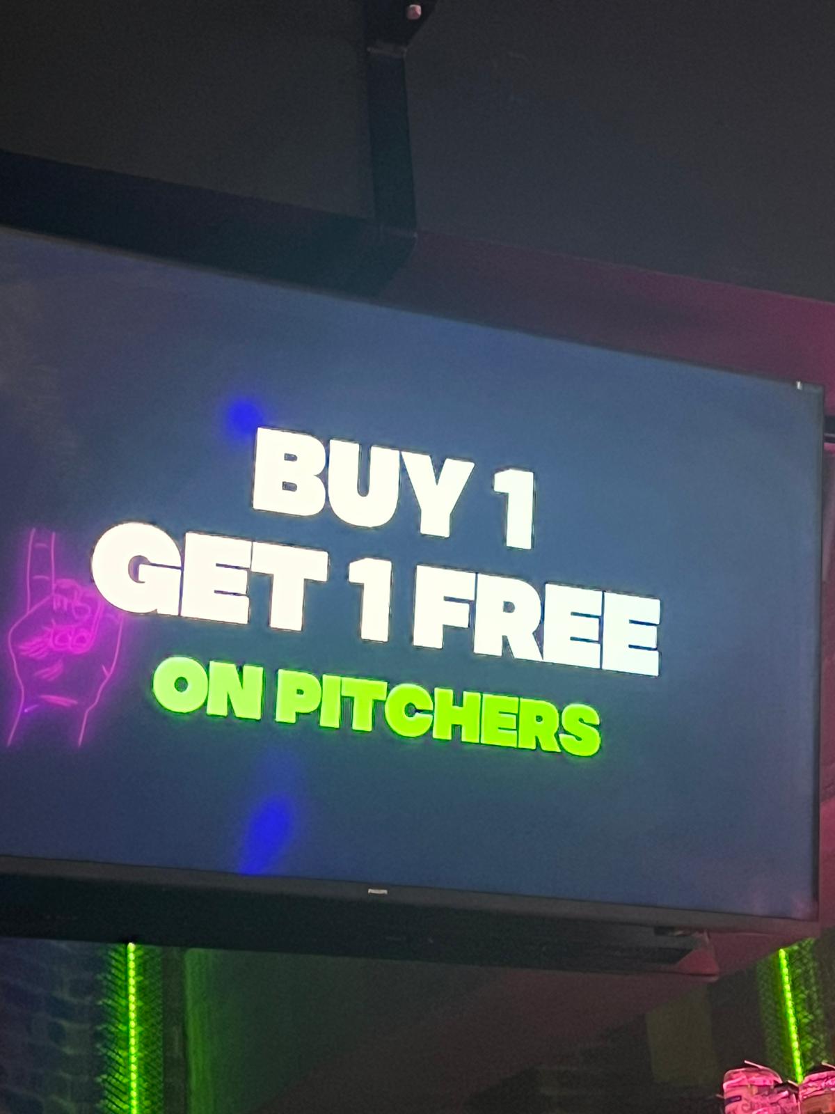 Screen displaying the "Buy 1 Get 1 Free on Pitchers" promo — an unmissable deal for going out in Paceville
