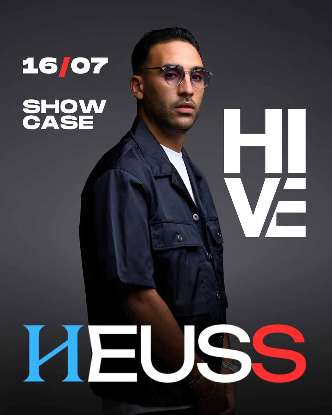 Heuss L’Enfoiré captured backstage before his showcase in sleek dark outfit and shades.
